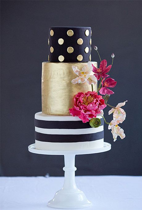 a-modern-black-and-gold-wedding-cake-with-flowers-and-fondant-dots-and-stripes-by-wild-orchid-baking-company